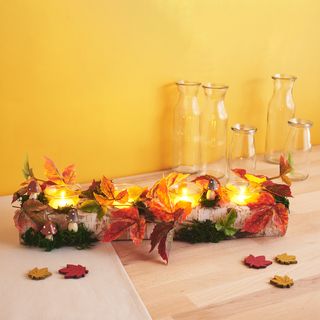 theelichthouder met herfstdecoratie